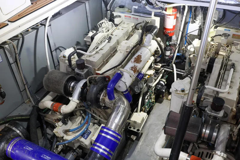 Slide: The Image of Engine room of a 2002 Sea Ray 410 Express Cruiser with visible machinery and components. - 30