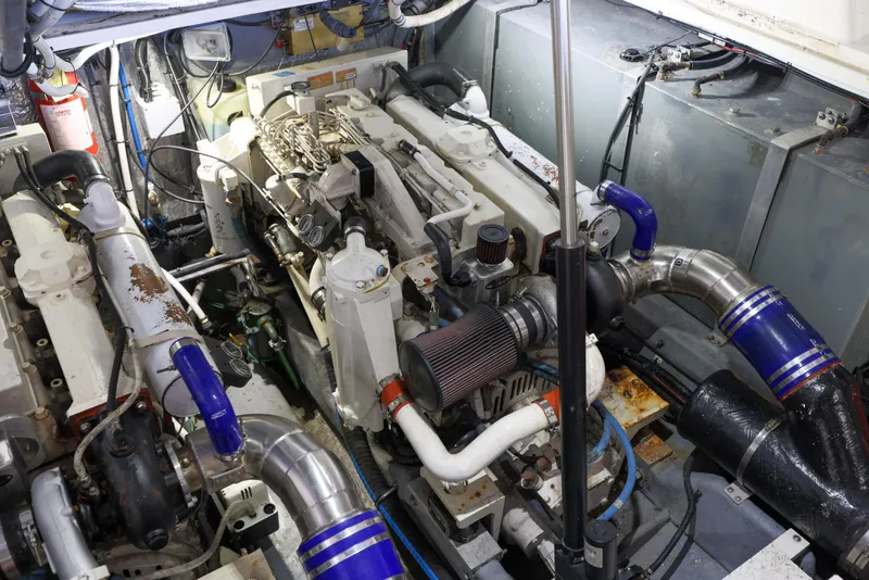 Slide: The Image of Engine room of a 2002 Sea Ray 410 Express Cruiser with visible machinery and components. - 31