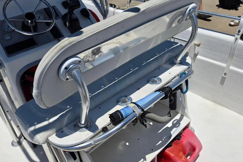 Slide: The Image of 2011 Carolina Skiff 258 DLV boat interior with steering console and seating area. - 9