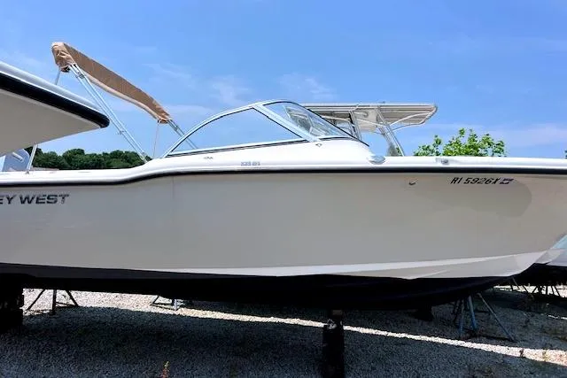 The Image of 2020 Key West 239 DFS boat with canopy, displayed outdoors on a sunny day. - 1