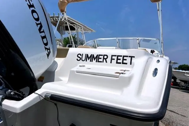 Slide: The Image of 2020 Key West 239 DFS boat with "Summer Feet" name, featuring a Honda engine. - 4