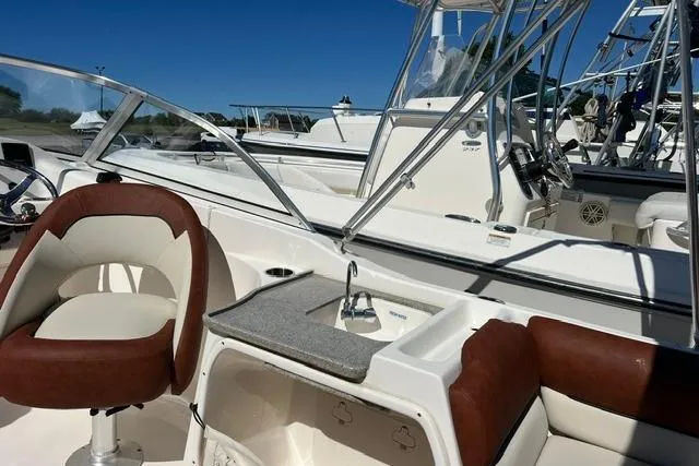 Slide: The Image of 2020 Key West 239 DFS boat interior with seating and console. - 6