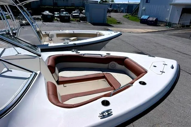 Slide: The Image of 2020 Key West 239 DFS boat with spacious seating and sleek design in a marina setting. - 8