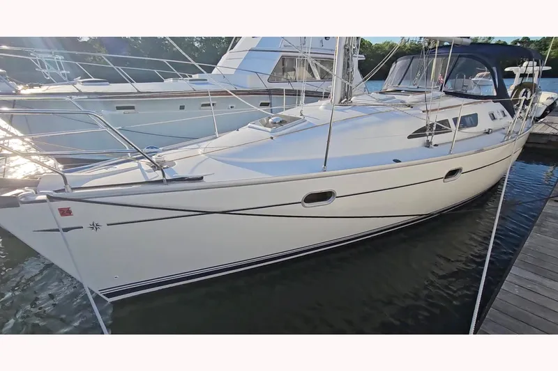 The Image of 2002 Jeanneau Sun Odyssey 37 sailboat docked at marina, side view. - 0