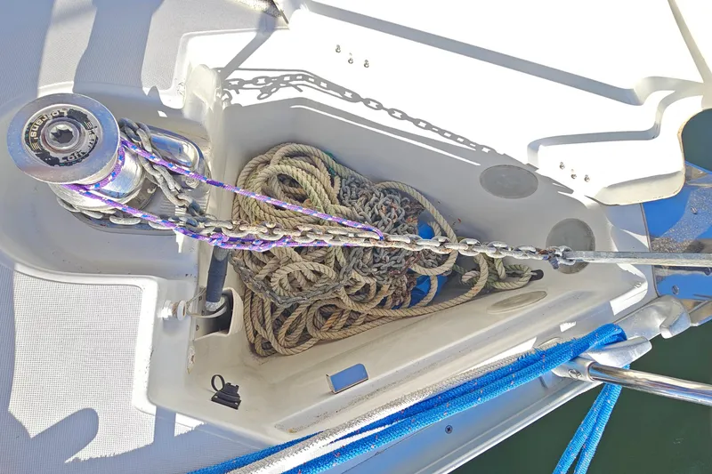 Slide: The Image of Anchor locker of 2002 Jeanneau Sun Odyssey 37 with ropes and chain. - 11