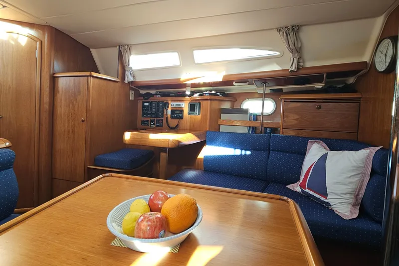 Slide: The Image of Interior of 2002 Jeanneau Sun Odyssey 37 sailboat with cozy seating and fruit bowl. - 14