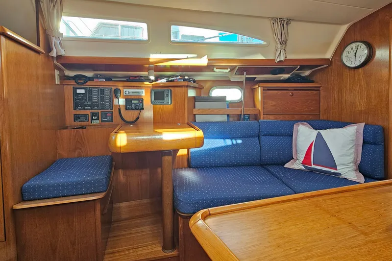 Slide: The Image of Interior of 2002 Jeanneau Sun Odyssey 37 sailboat with cozy seating and navigation equipment. - 16