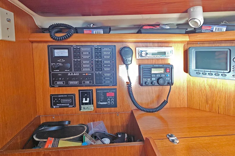 Slide: The Image of Control panel of a 2002 Jeanneau Sun Odyssey 37 sailboat with navigation equipment. - 17