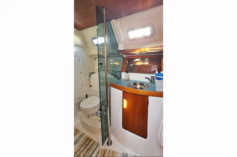 Slide: The Image of Interior of 2002 Jeanneau Sun Odyssey 37 yacht bathroom with sink and toilet. - 23