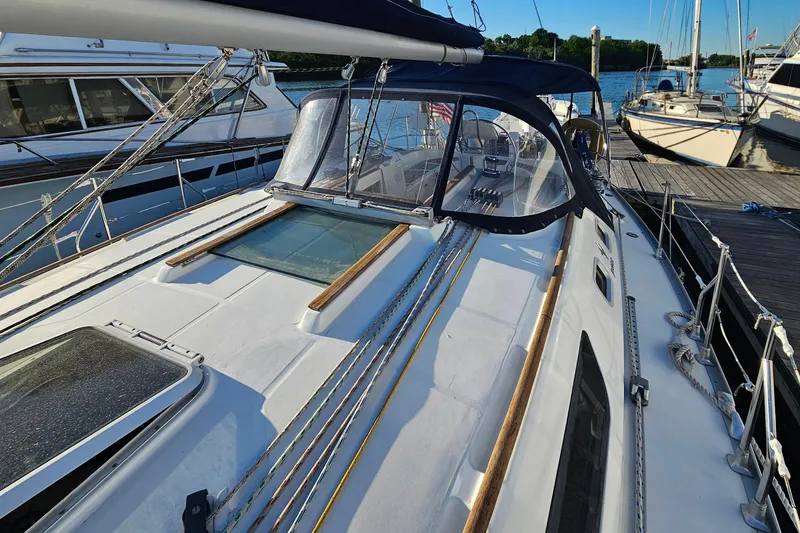 Slide: The Image of 2002 Jeanneau Sun Odyssey 37 sailboat docked, showcasing deck and rigging details. - 4