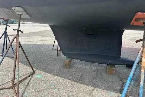 Slide: The Image of 2002 Jeanneau Sun Odyssey 37 sailboat keel on stands in a boatyard. - 27