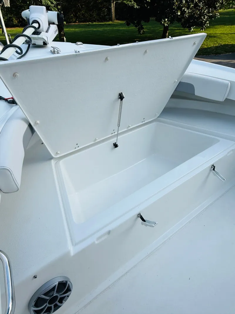 Slide: The Image of Open storage compartment on a Parker 21 boat, model 2024. - 13