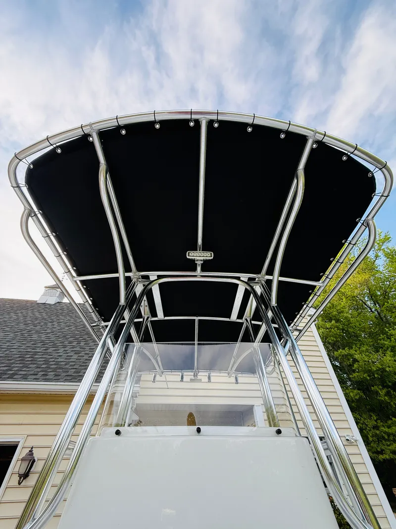 Slide: The Image of Parker 21 boat 2024 with black canopy and stainless steel frame. - 16