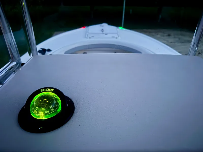 Slide: The Image of Parker 21 boat 2024 with illuminated compass at dusk. - 29