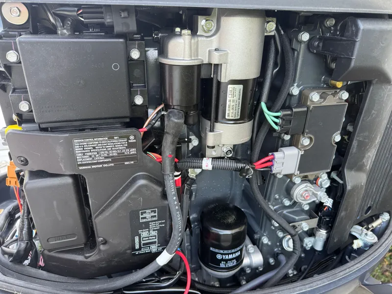 Slide: The Image of Close-up of a Parker 21 engine, 2024 model, featuring Yamaha oil filter. - 7
