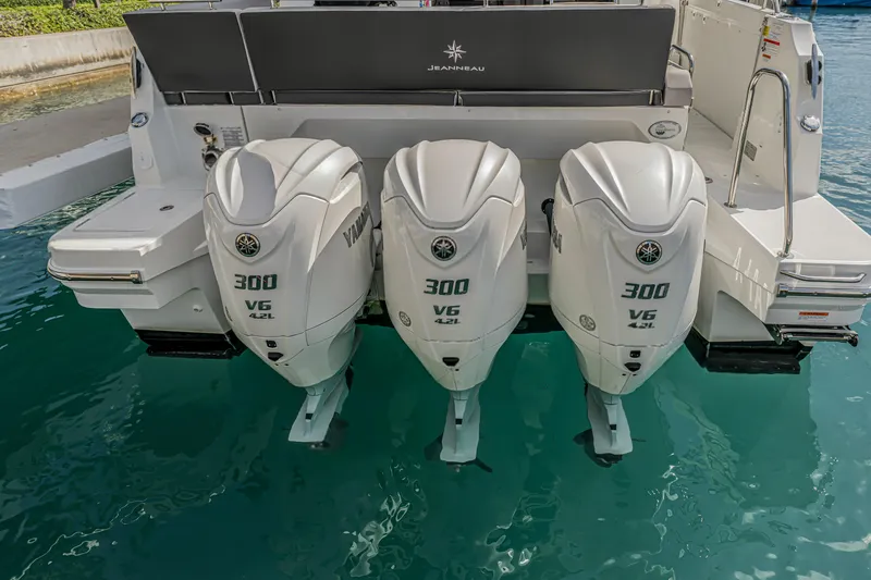 Slide: The Image of 2025 Jeanneau NC 1295 Fly with triple Yamaha 300 V6 outboard engines. - 21