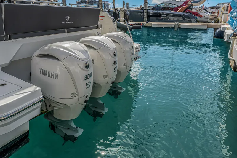 Slide: The Image of 2025 Jeanneau NC 1295 Fly with Yamaha 300 V6 engines docked in marina. - 22