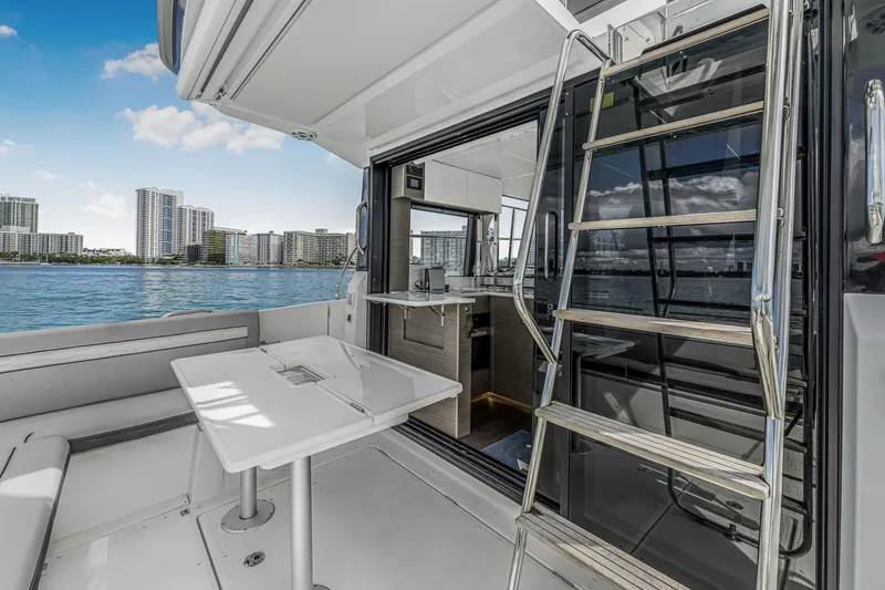 Slide: The Image of 2025 Jeanneau NC 1295 Fly yacht interior with city skyline view. - 8