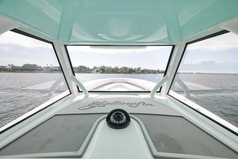 Slide: The Image of Interior view of 2017 Yellowfin 39 Offshore boat, showcasing helm and panoramic windows. - 16