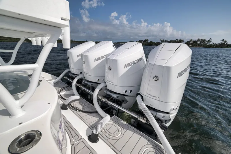 Slide: The Image of 2017 Yellowfin 39 Offshore boat with triple Mercury Verado engines on open water. - 19