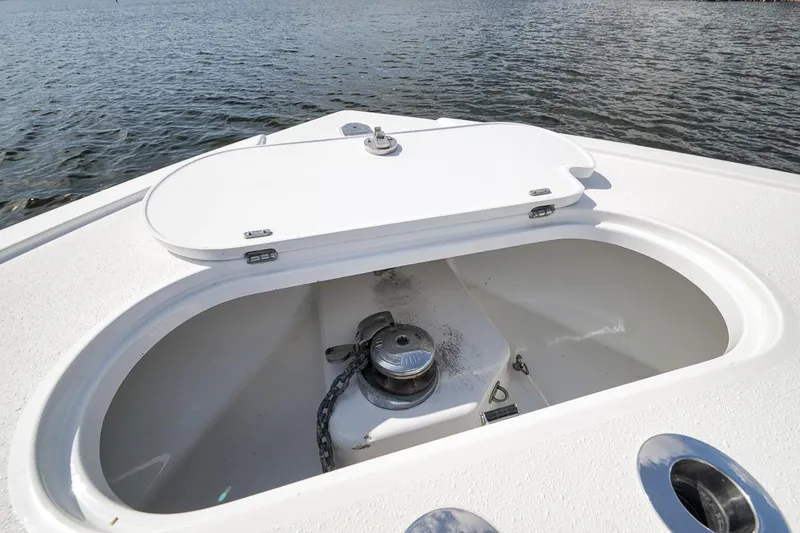 Slide: The Image of 2017 Yellowfin 39 Offshore boat anchor compartment with open hatch, on calm water. - 26
