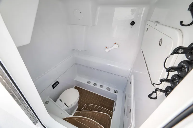 Slide: The Image of 2017 Yellowfin 39 Offshore boat interior with toilet and storage area. - 27