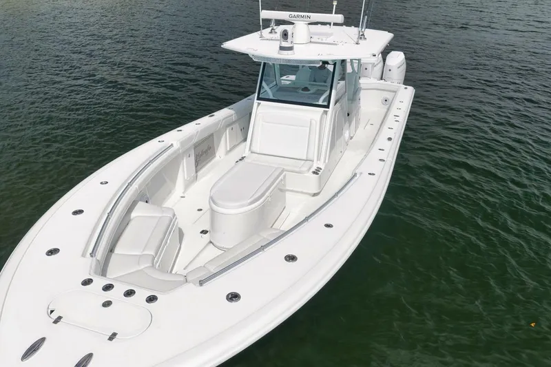 Slide: The Image of 2017 Yellowfin 39 Offshore boat on calm water, showcasing sleek design and spacious deck. - 28