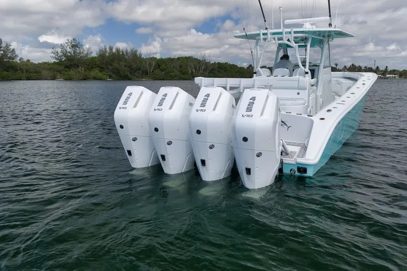 Slide: The Image of 2017 Yellowfin 39 Offshore boat with four powerful outboard engines on a calm lake. - 3