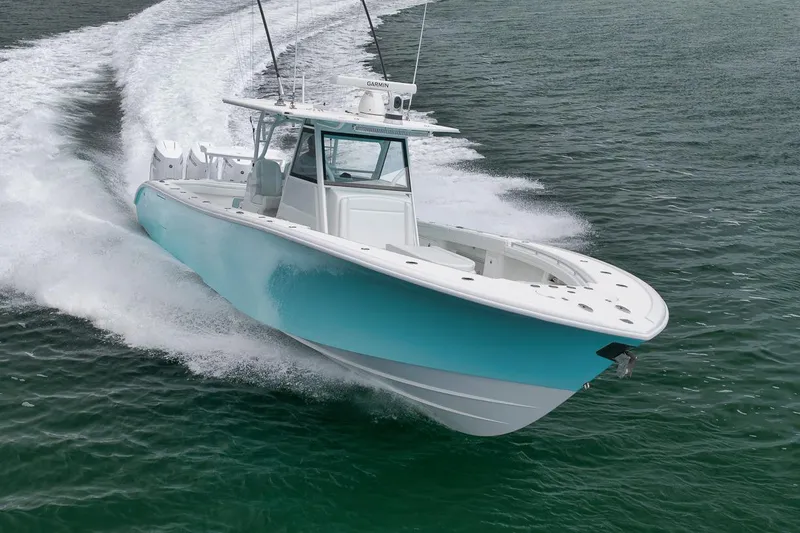 Slide: The Image of 2017 Yellowfin 39 Offshore boat cruising on open water, showcasing sleek design and performance. - 32