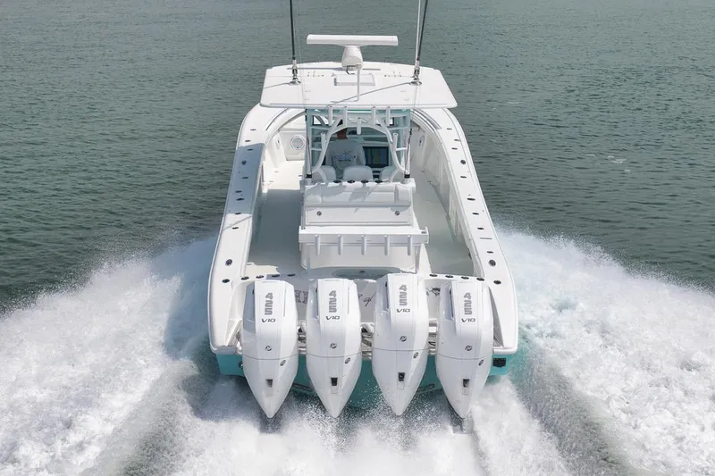 Slide: The Image of 2017 Yellowfin 39 Offshore boat with four powerful outboard engines cruising on water. - 34
