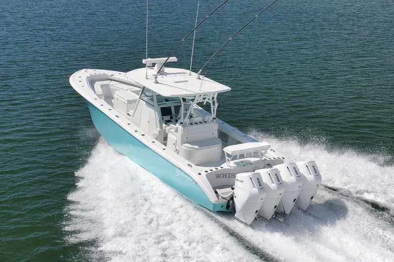 Slide: The Image of 2017 Yellowfin 39 Offshore boat cruising on open water with four engines. - 35