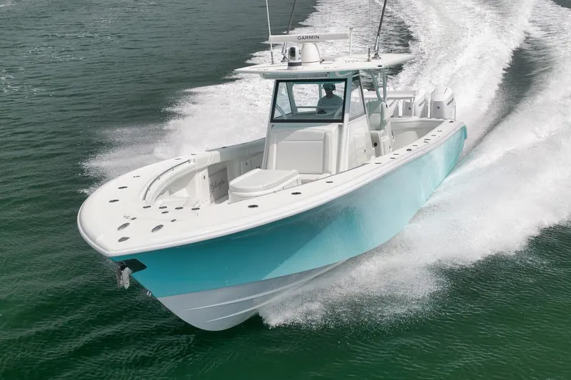 Slide: The Image of 2017 Yellowfin 39 Offshore boat cruising on open water, showcasing sleek design and performance. - 36