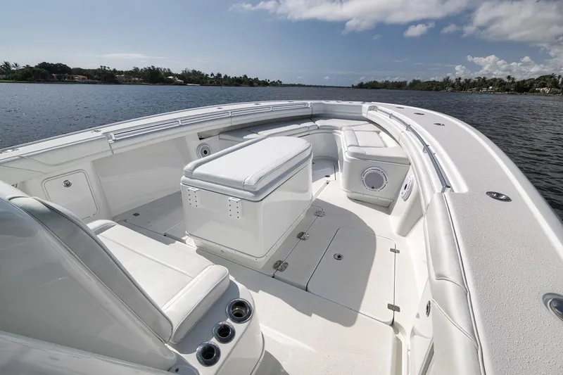 Slide: The Image of 2017 Yellowfin 39 Offshore boat interior with seating and storage on calm water. - 5
