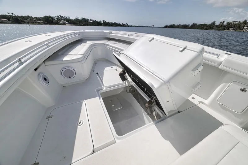 Slide: The Image of 2017 Yellowfin 39 Offshore boat interior with seating and storage compartments. - 7