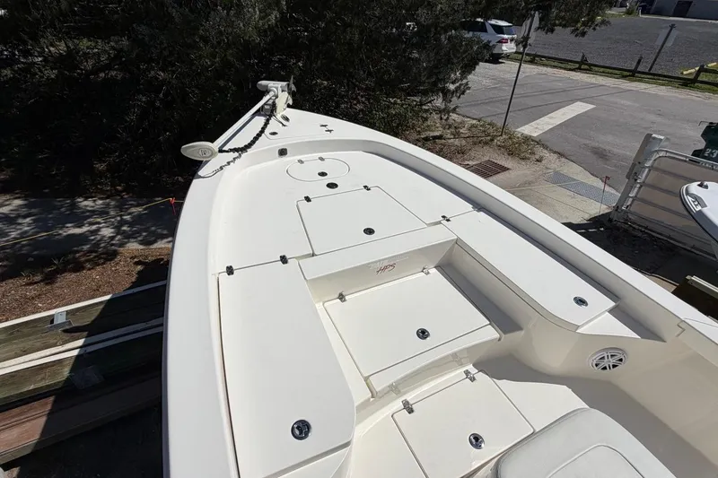 Slide: The Image of 2022 Pathfinder 2600 HPS boat deck with storage compartments and trolling motor. - 10