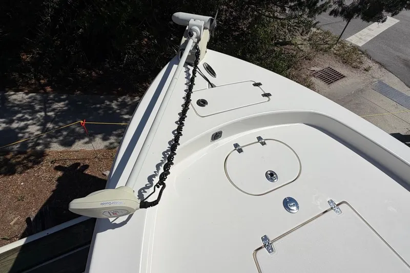 Slide: The Image of 2022 Pathfinder 2600 HPS boat deck with trolling motor and storage compartments. - 11