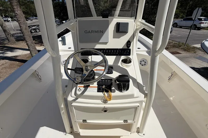 Slide: The Image of 2022 Pathfinder 2600 HPS boat console with Garmin navigation system and steering wheel. - 20