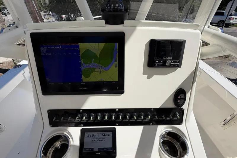 Slide: The Image of 2022 Pathfinder 2600 HPS boat dashboard with Garmin navigation and JL Audio system. - 23
