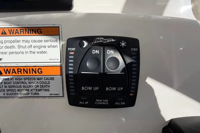 Slide: The Image of Control panel of a 2022 Pathfinder 2600 HPS boat with warning labels. - 26