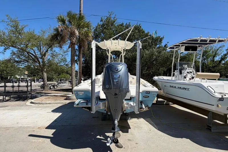 Slide: The Image of 2022 Pathfinder 2600 HPS boat with Yamaha outboard motor, parked outdoors. - 4
