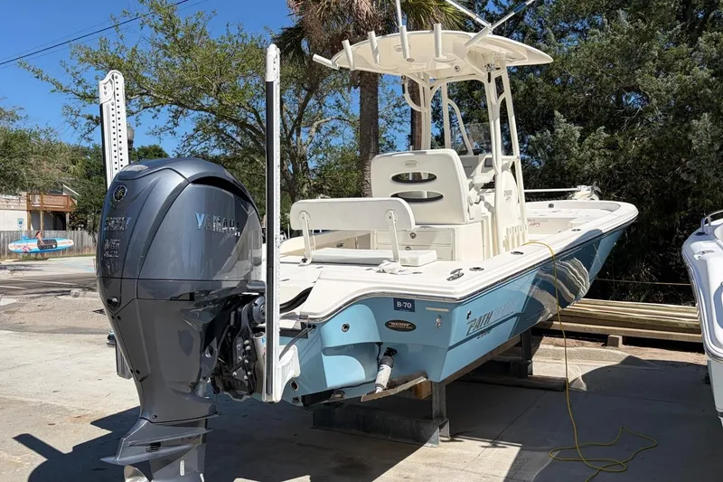 Slide: The Image of 2022 Pathfinder 2600 HPS boat with Yamaha engine, docked outdoors. - 5