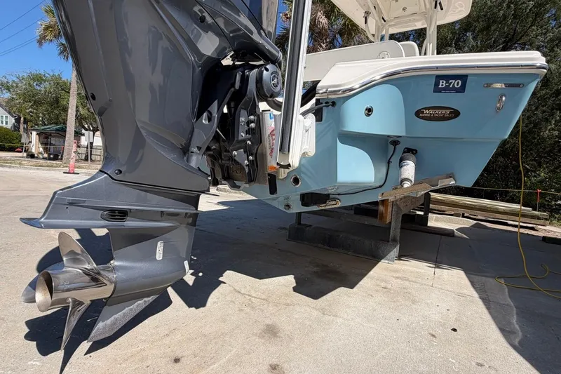 Slide: The Image of 2022 Pathfinder 2600 HPS boat on a trailer, showcasing the outboard motor. - 8