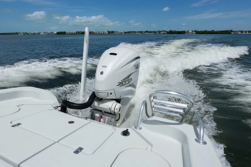 Slide: The Image of 2019 Blue Wave 2800 Pure Hybrid boat cruising on open water with powerful engine. - 10
