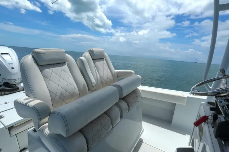 Slide: The Image of Luxury seating on a 2019 Blue Wave 2800 Pure Hybrid boat, ocean view. - 15