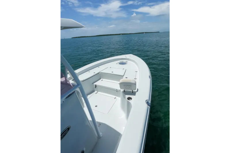Slide: The Image of 2019 Blue Wave 2800 Pure Hybrid boat on calm ocean waters under a clear sky. - 21