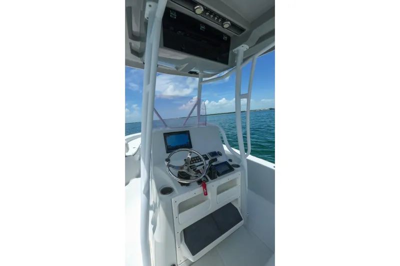Slide: The Image of 2019 Blue Wave 2800 Pure Hybrid boat console with steering wheel and navigation system. - 23