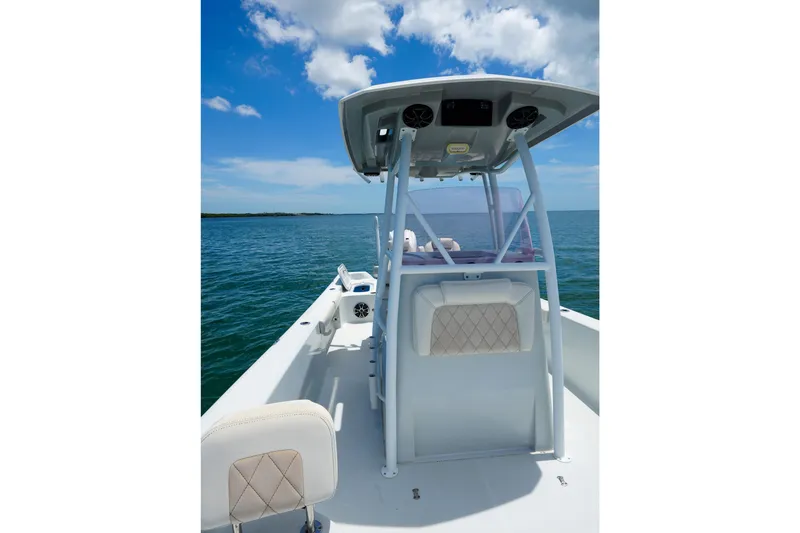 Slide: The Image of 2019 Blue Wave 2800 Pure Hybrid boat on open water under blue sky. - 26