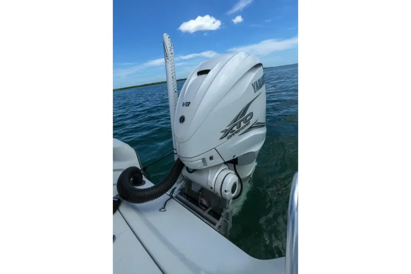 Slide: The Image of 2019 Blue Wave 2800 Pure Hybrid boat with Yamaha V8 XTO outboard engine on open water. - 28