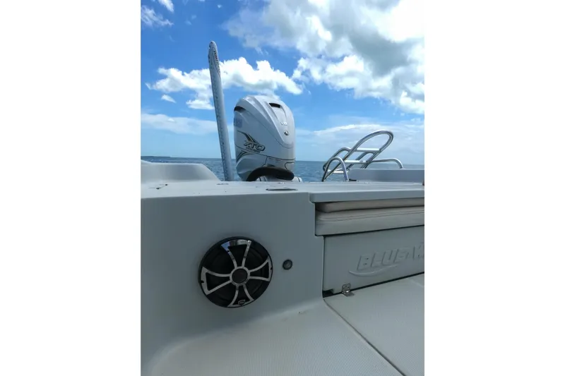 Slide: The Image of 2019 Blue Wave 2800 Pure Hybrid boat with Yamaha engine on open water. - 29