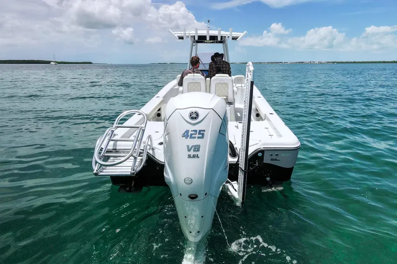 Slide: The Image of 2019 Blue Wave 2800 Pure Hybrid boat with Yamaha 425 V8 engine on open water. - 3